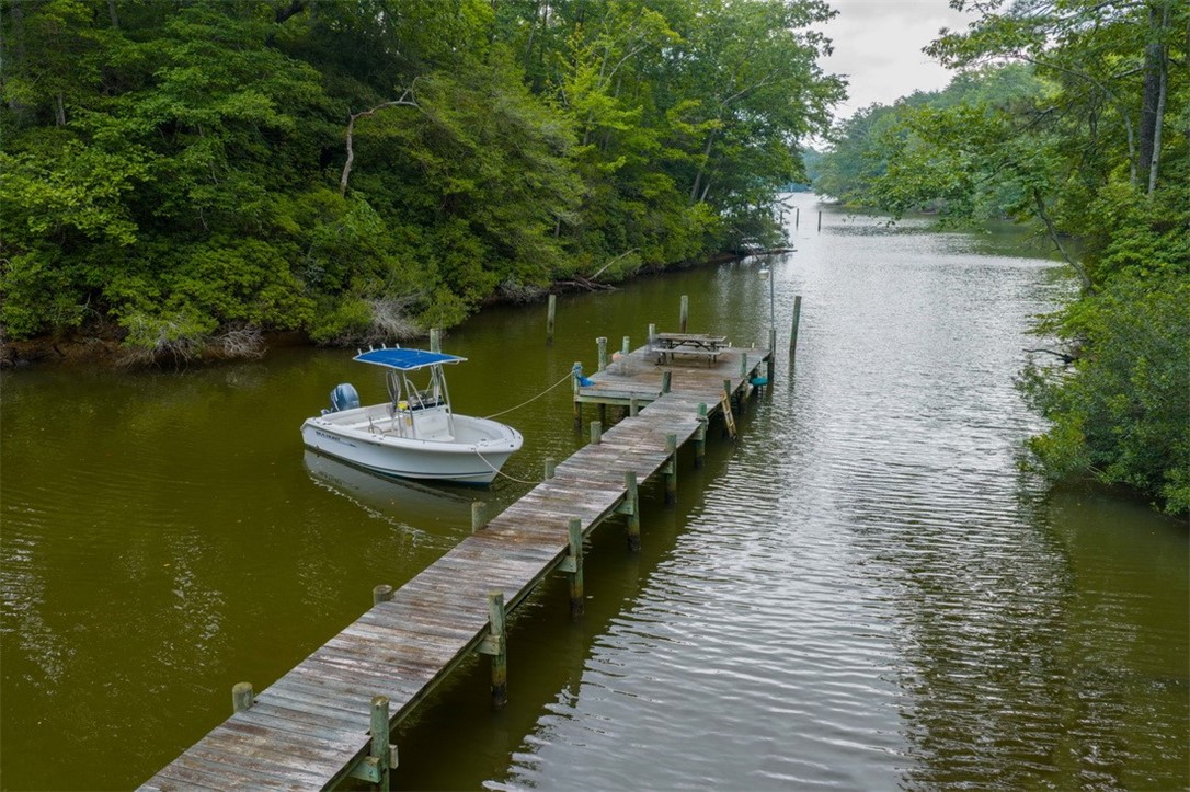 846 Twiggs Ferry Road Hartfield, VA 23071 - Photo 28 of 28 Dock area with a water view and a view of trees
