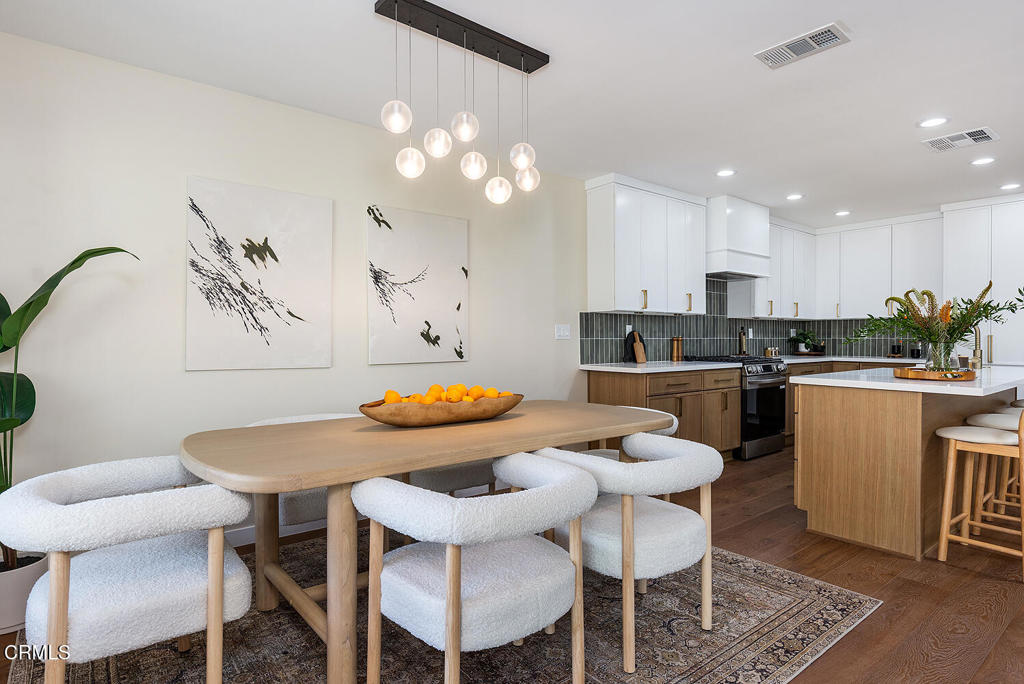 2650 Catherine Road Altadena, CA 91001 - Photo 11 of 37 a kitchen with a dining table chairs and white appliances