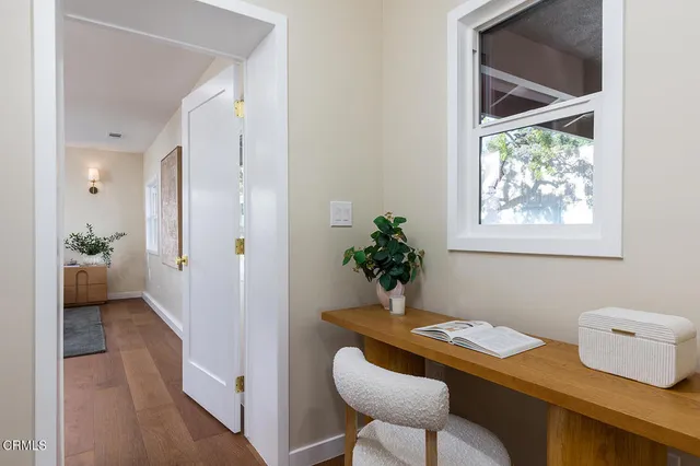 a view of bathroom with a potted plant on a sink and a potted plant