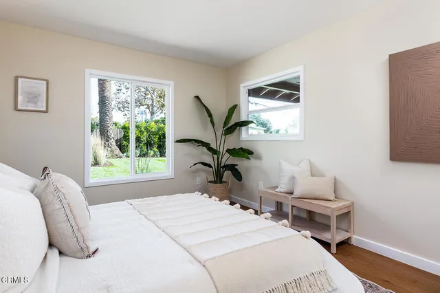 a bedroom with bed and a window