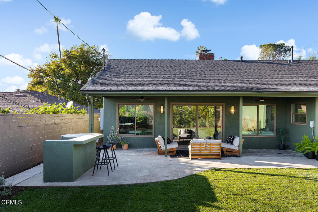 2650 Catherine Road Altadena, CA 91001 - Photo 28 of 37 a view of a patio with couches chairs potted plants and a table and chairs