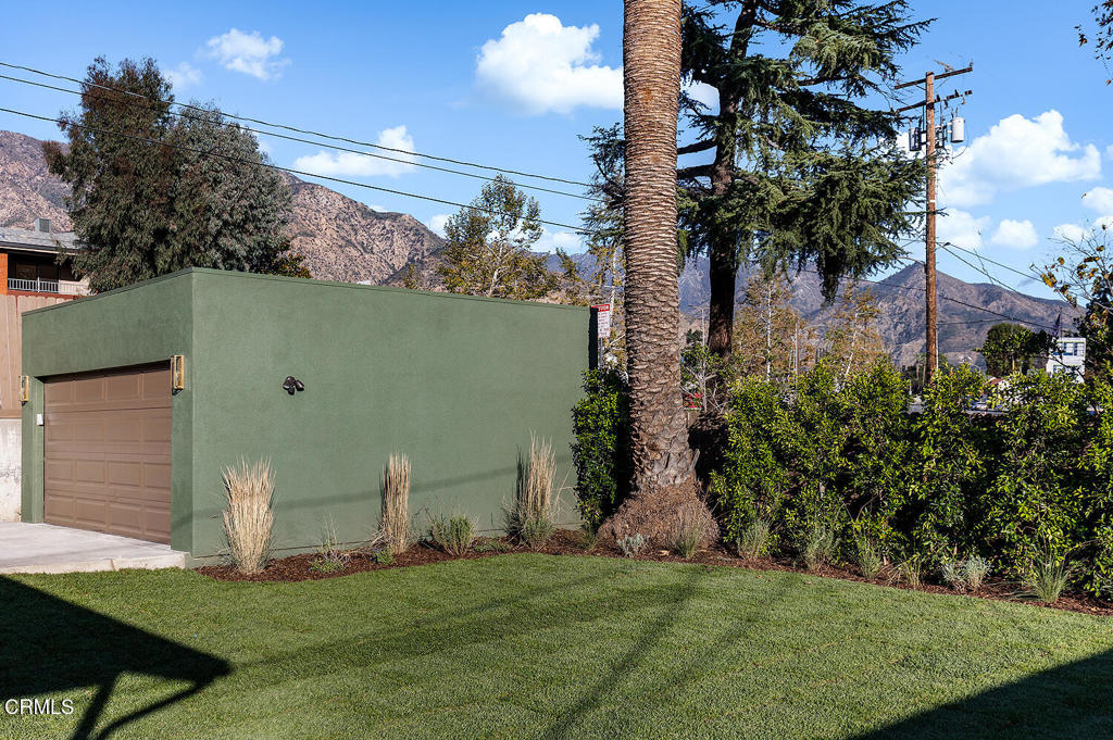 2650 Catherine Road Altadena, CA 91001 - Photo 30 of 37 a view of a chair and table and potted on the side of the green field