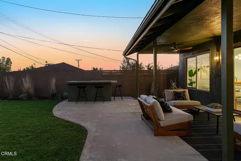 a view of backyard with seating space