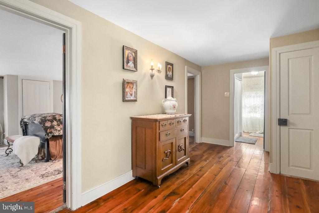 9 Eayrestown Road Medford, NJ 08055 - Photo 59 of 78 a view of a hallway with wooden floor and bedroom view