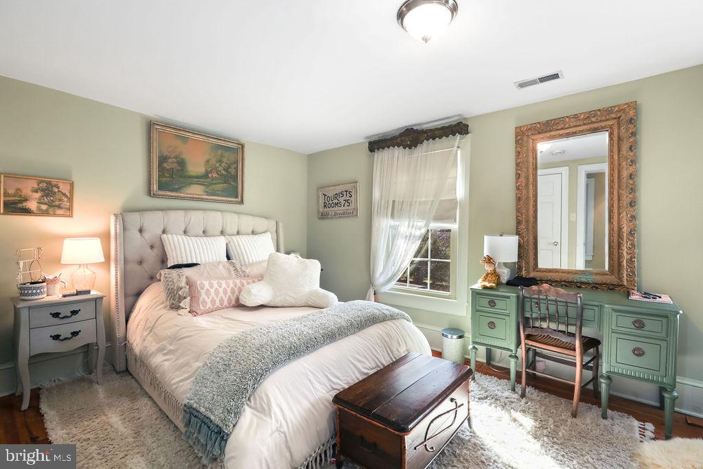 9 Eayrestown Road Medford, NJ 08055 - Photo 61 of 78 a bedroom with a bed and a chandelier