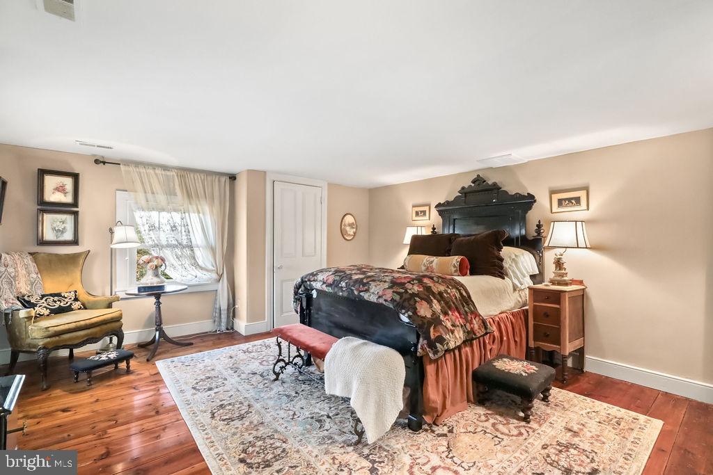 9 Eayrestown Road Medford, NJ 08055 - Photo 64 of 78 a bedroom with a bed and wooden floor