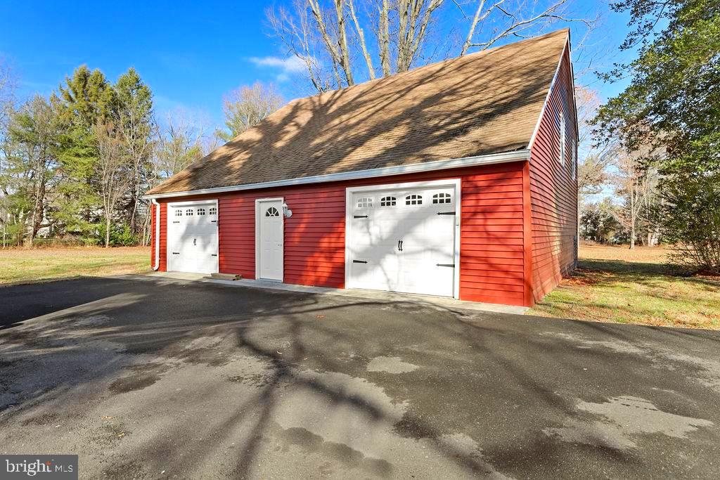 9 Eayrestown Road Medford, NJ 08055 - Photo 65 of 78 a view of a house with a backyard and a garage