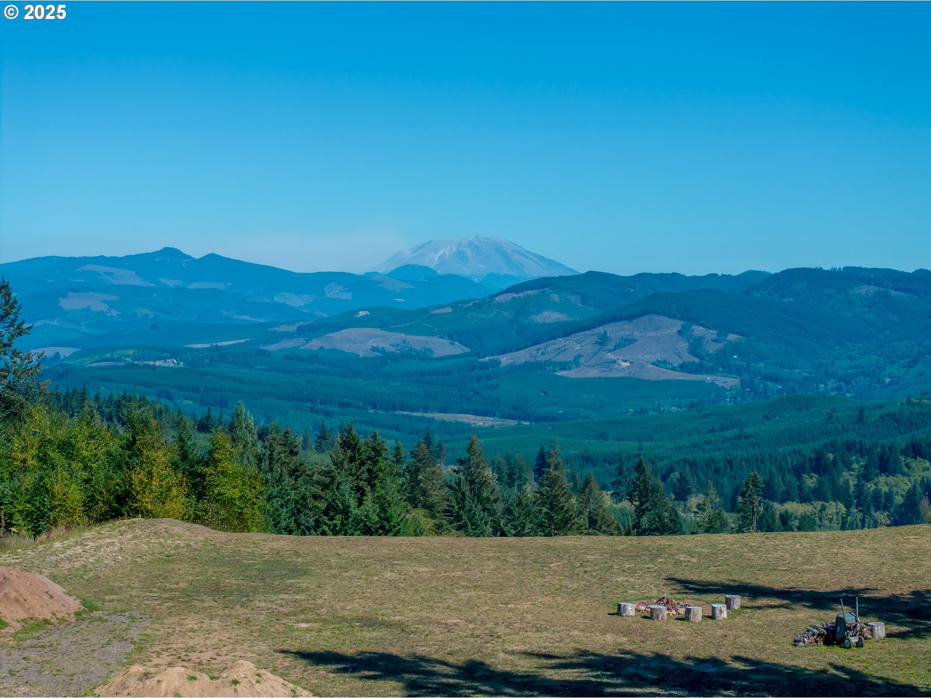 787 Five Peaks Drive Kalama, WA 98625 - Photo 2 of 14 a view of a mountain with a field
