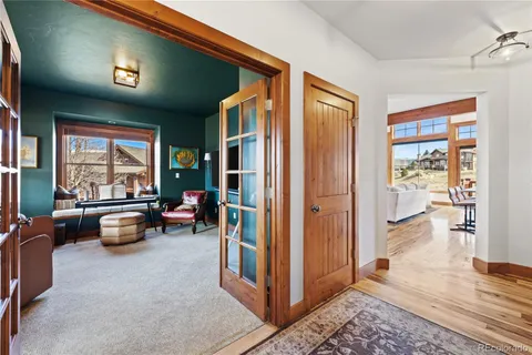 a view of a livingroom with furniture and a window