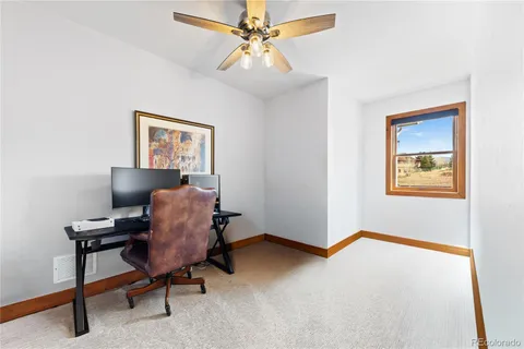 a workspace with furniture and a window