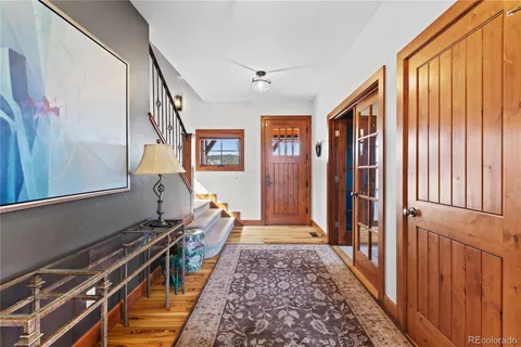a hallway with a large mirror and a window