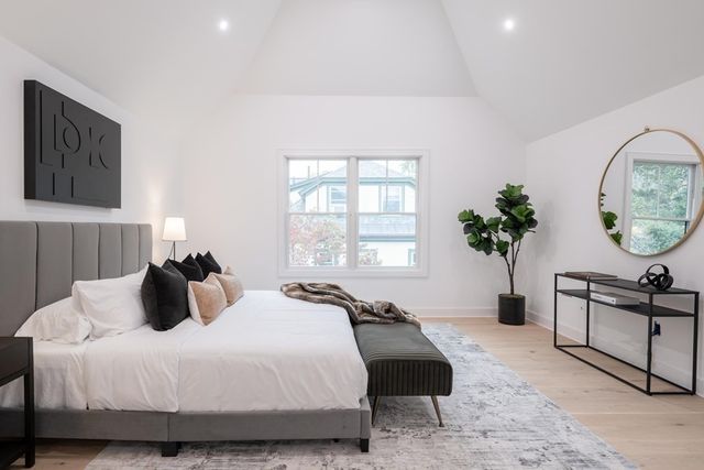 a bedroom with bed and a window