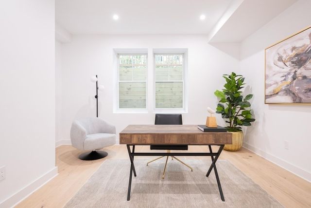 a workspace with furniture and a potted plant