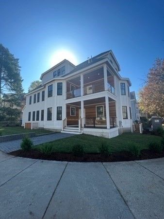 a view of house with yard and green space