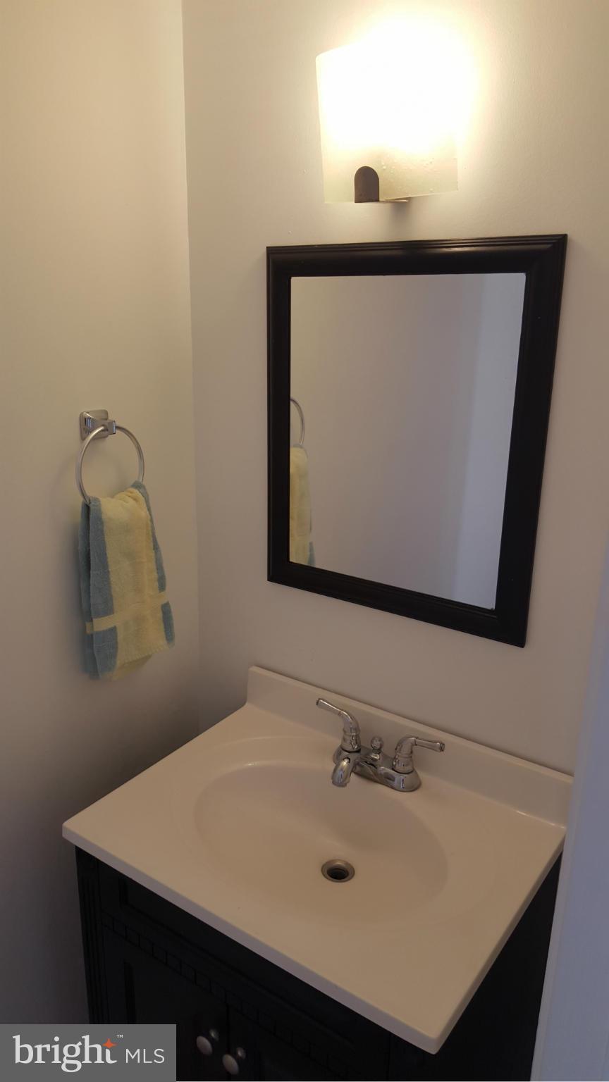 3855 Kearnys Inn Place Waldorf, MD 20602 - Photo 3 of 8 a bathroom with a sink vanity and mirror