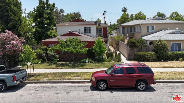 a front view of a house with parking space
