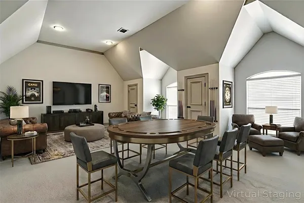 a view of a dining room with furniture and a flat screen tv