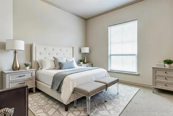 a spacious bedroom with a bed and a window