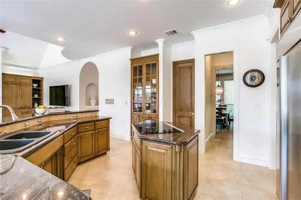 a kitchen with stainless steel appliances granite countertop a stove and a sink