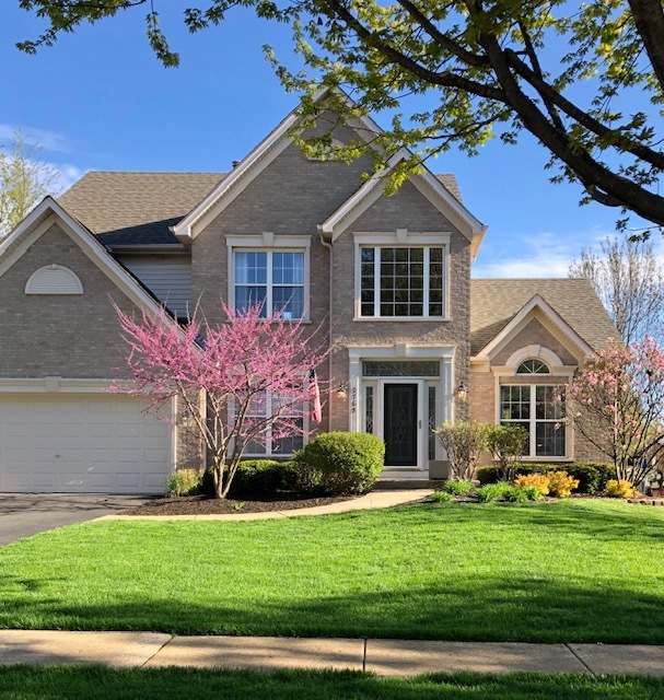 2765 Miller Road Geneva, IL 60134 - Photo 1 of 11 a front view of a house with a yard
