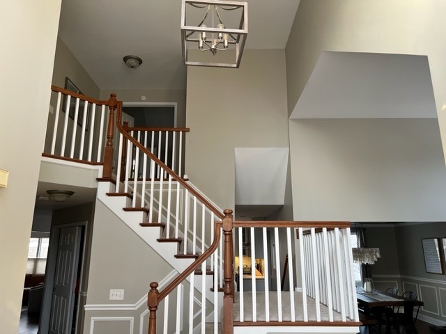 2765 Miller Road Geneva, IL 60134 - Photo 2 of 11 a view of staircase with railing and white walls