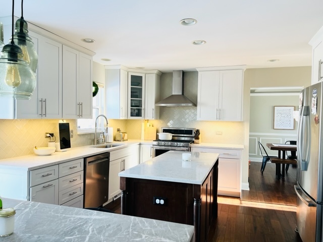 2765 Miller Road Geneva, IL 60134 - Photo 3 of 11 a kitchen with a stove a sink and a refrigerator