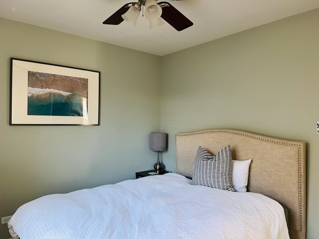 2765 Miller Road Geneva, IL 60134 - Photo 8 of 11 a bedroom with a bed and painting on the wall