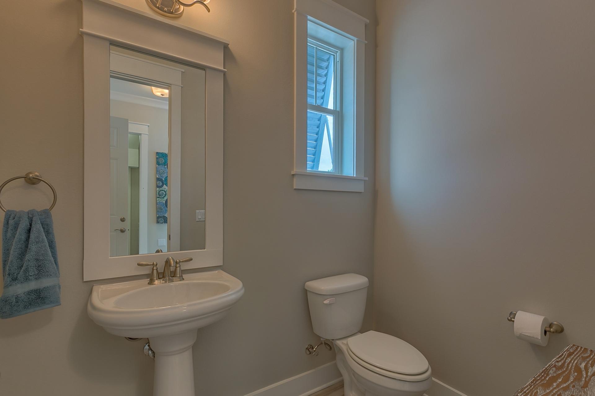 25 East Milestone Drive Inlet Beach, FL 32461 - Photo 20 of 40 a bathroom with a sink a toilet and mirror