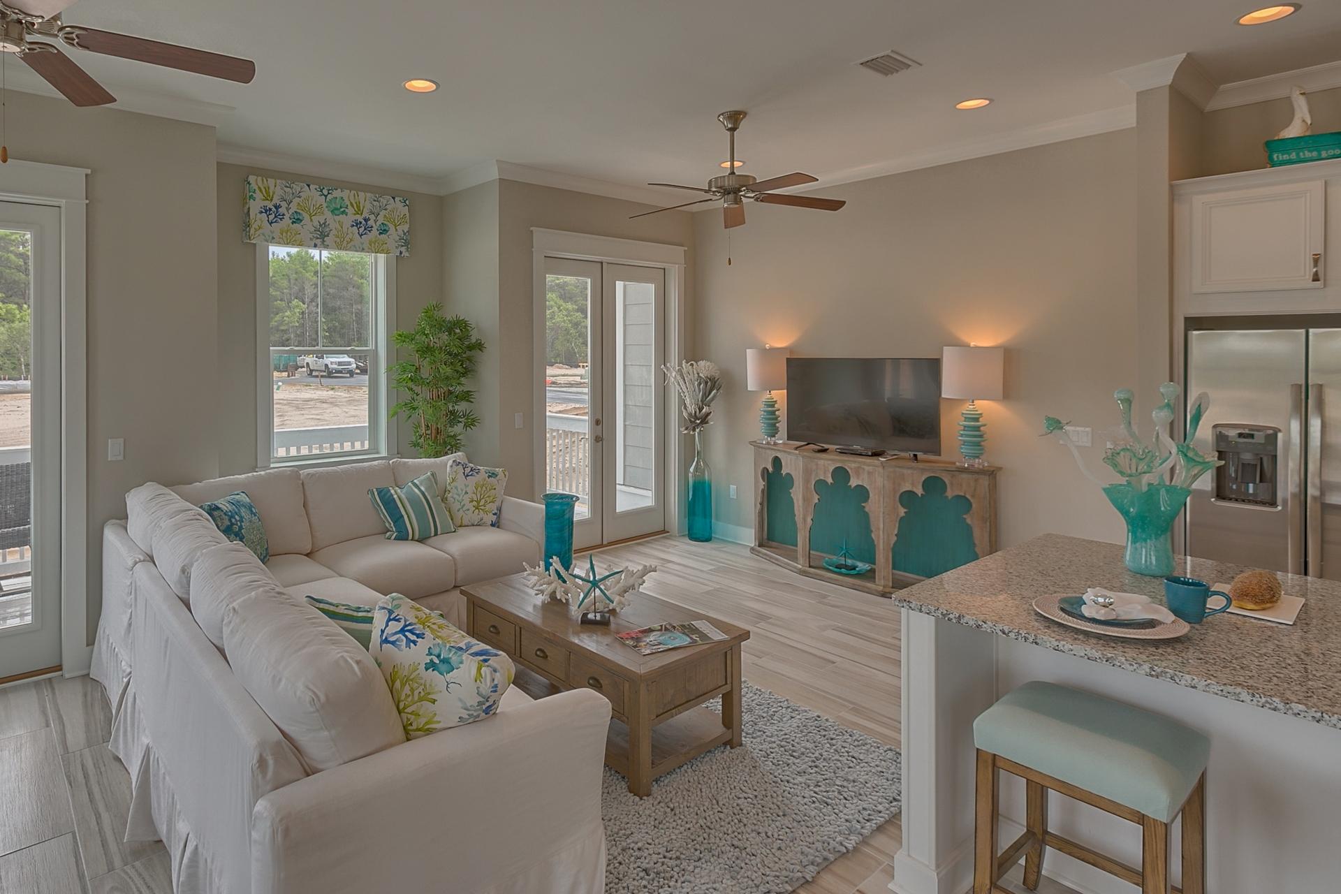 25 East Milestone Drive Inlet Beach, FL 32461 - Photo 26 of 40 a living room with furniture a large window and a flat screen tv