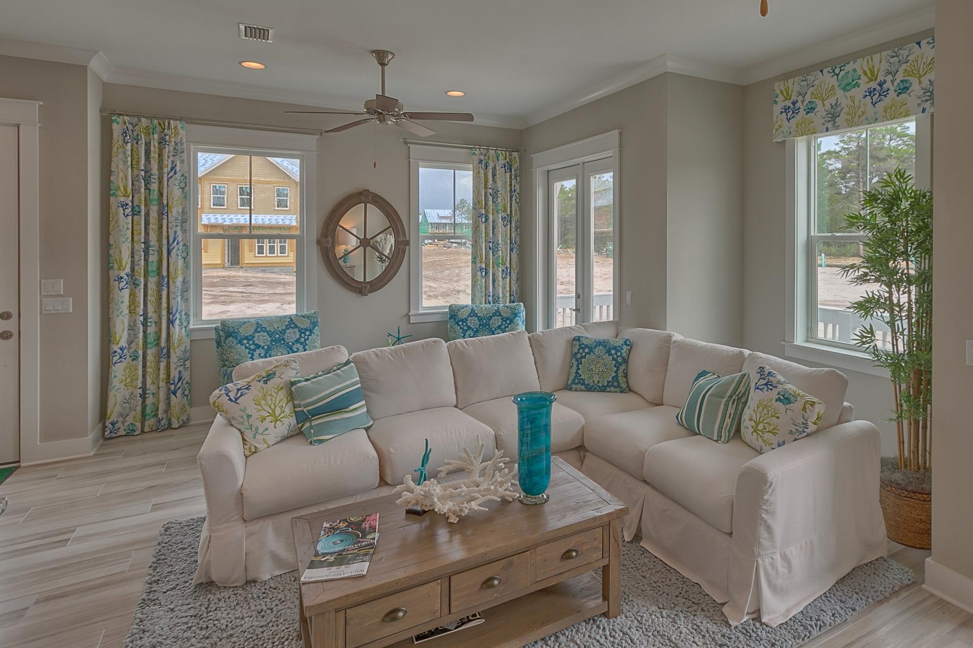 25 East Milestone Drive Inlet Beach, FL 32461 - Photo 28 of 40 a living room with furniture a large window and a wooden floor
