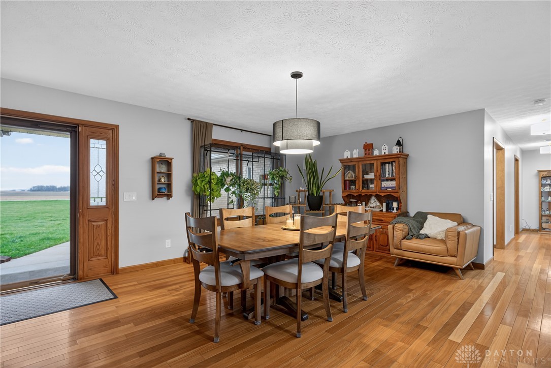 5264 Frazier-Guy Road Sidney, OH 45365 - Photo 8 of 51 This inviting dining area features rich wood flooring and abundant natural light, perfect for gatherings.