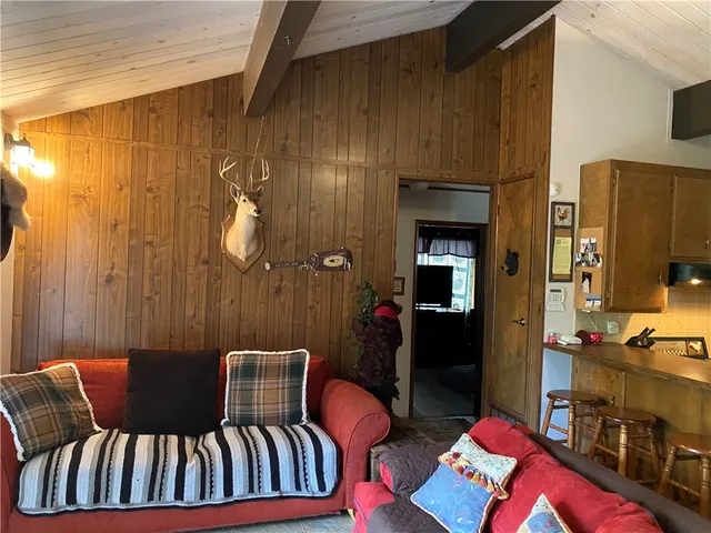 a balcony view with a couch and dining table