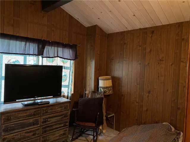 a living room with a flat screen tv and furniture