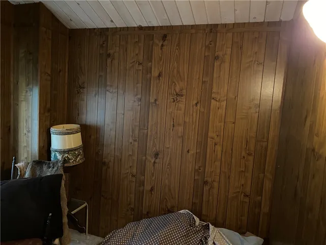 a bedroom with a bed and a closet