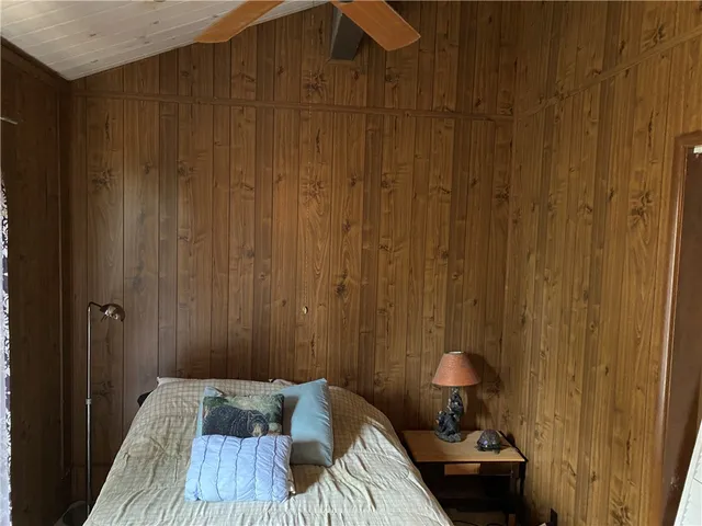 a bedroom with a bed and a table