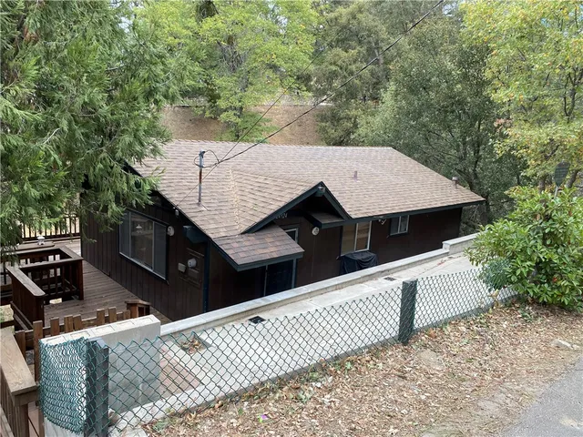 an aerial view of a house with roof deck