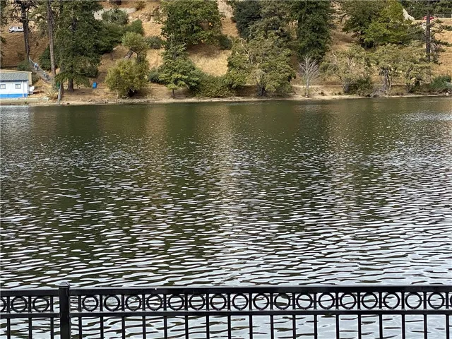 a view of roof deck with wooden floor and a tree