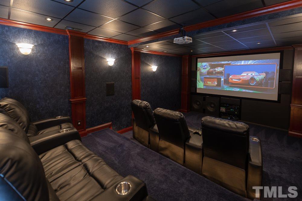 2924 Sunnystone Way Raleigh, NC 27613 - Photo 23 of 30 a projector room with furniture