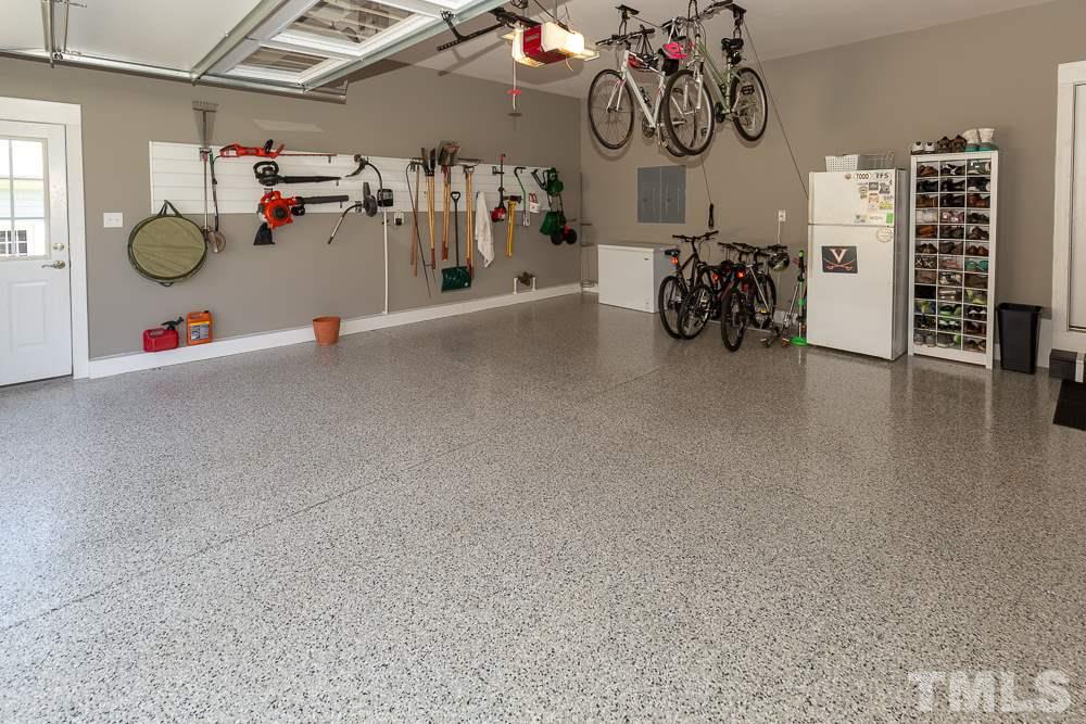 2924 Sunnystone Way Raleigh, NC 27613 - Photo 25 of 30 a view of storage and utility room with racks on the wall