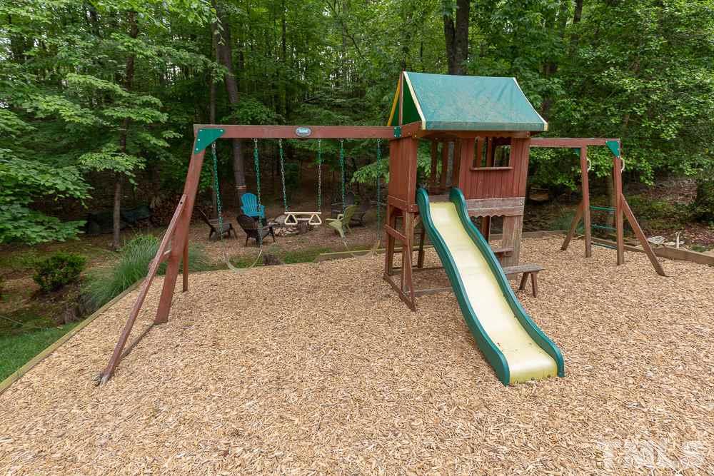 2924 Sunnystone Way Raleigh, NC 27613 - Photo 26 of 30 a view of a park with a slide