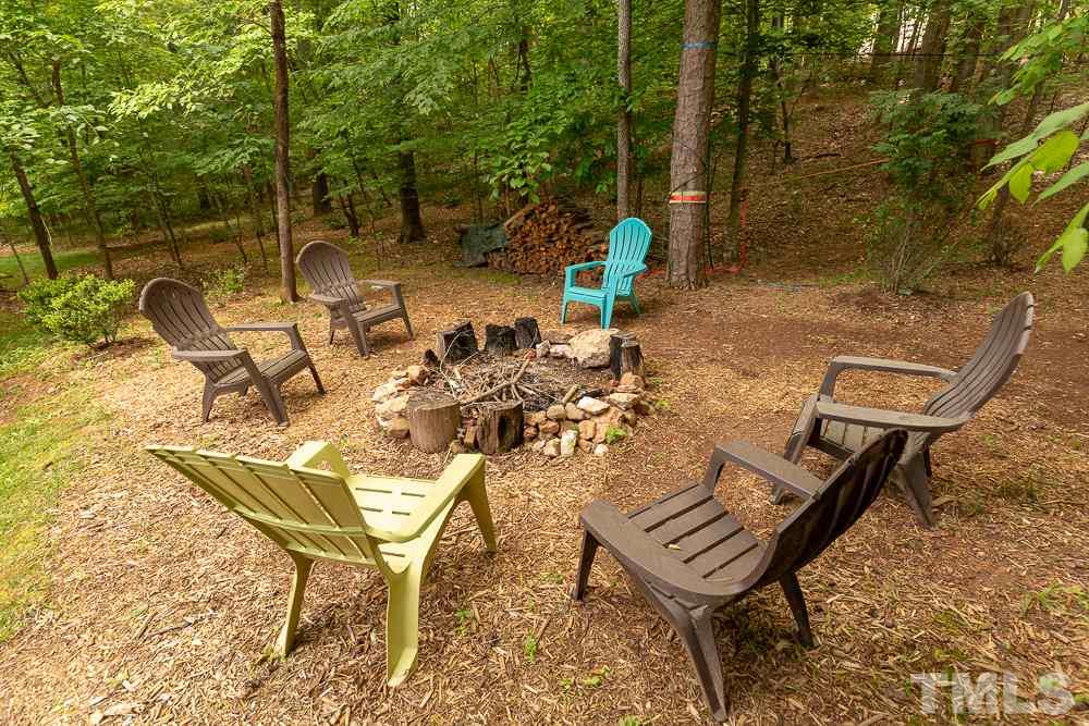 2924 Sunnystone Way Raleigh, NC 27613 - Photo 27 of 30 a view of a chairs and table in the patio