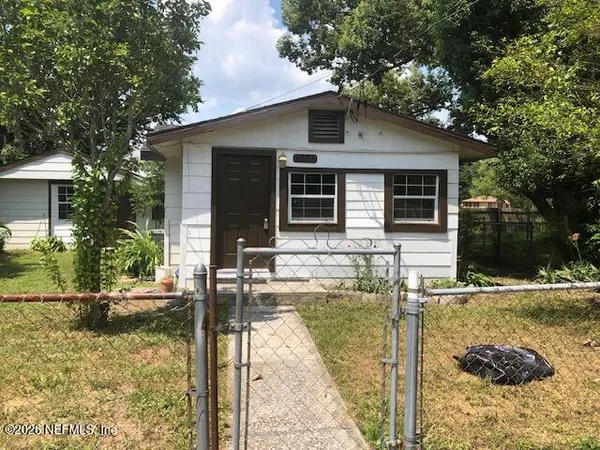 a house with trees in the background