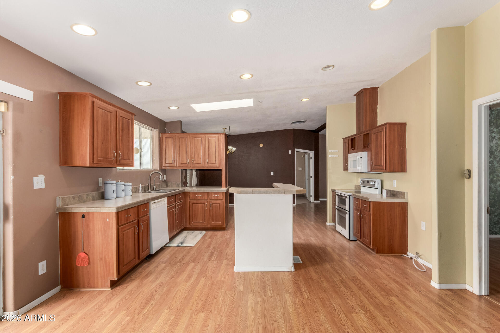 23851 West Tether Trail Wittmann, AZ 85361 - Photo 17 of 44 a large kitchen with stainless steel appliances lots of counter top space