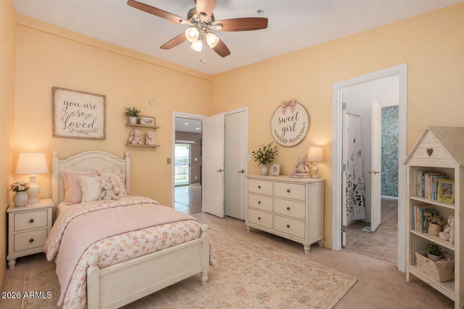 23851 West Tether Trail Wittmann, AZ 85361 - Photo 25 of 44 a bedroom with a bed and a chandelier