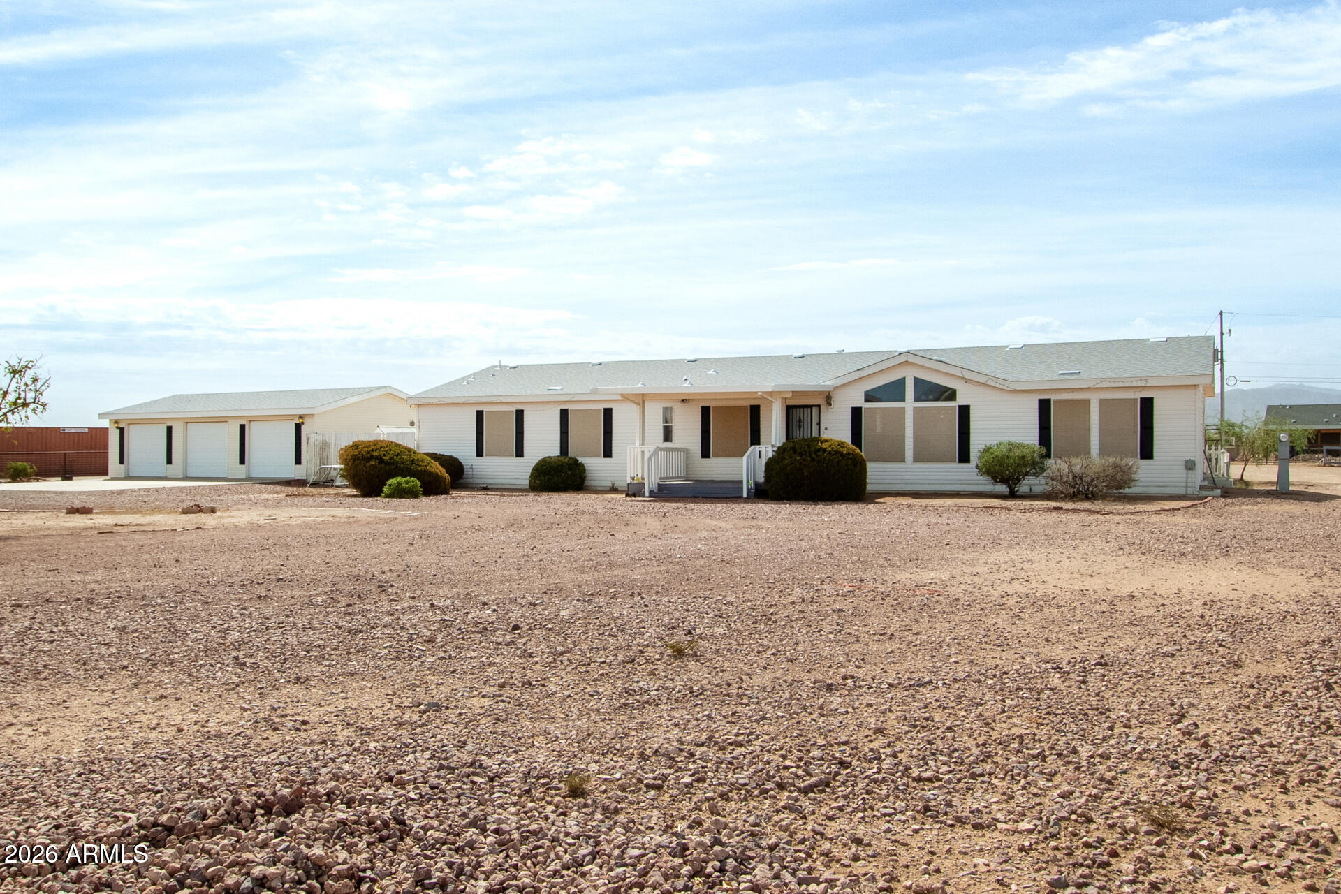 23851 West Tether Trail Wittmann, AZ 85361 - Photo 2 of 44 a view of house with a yard