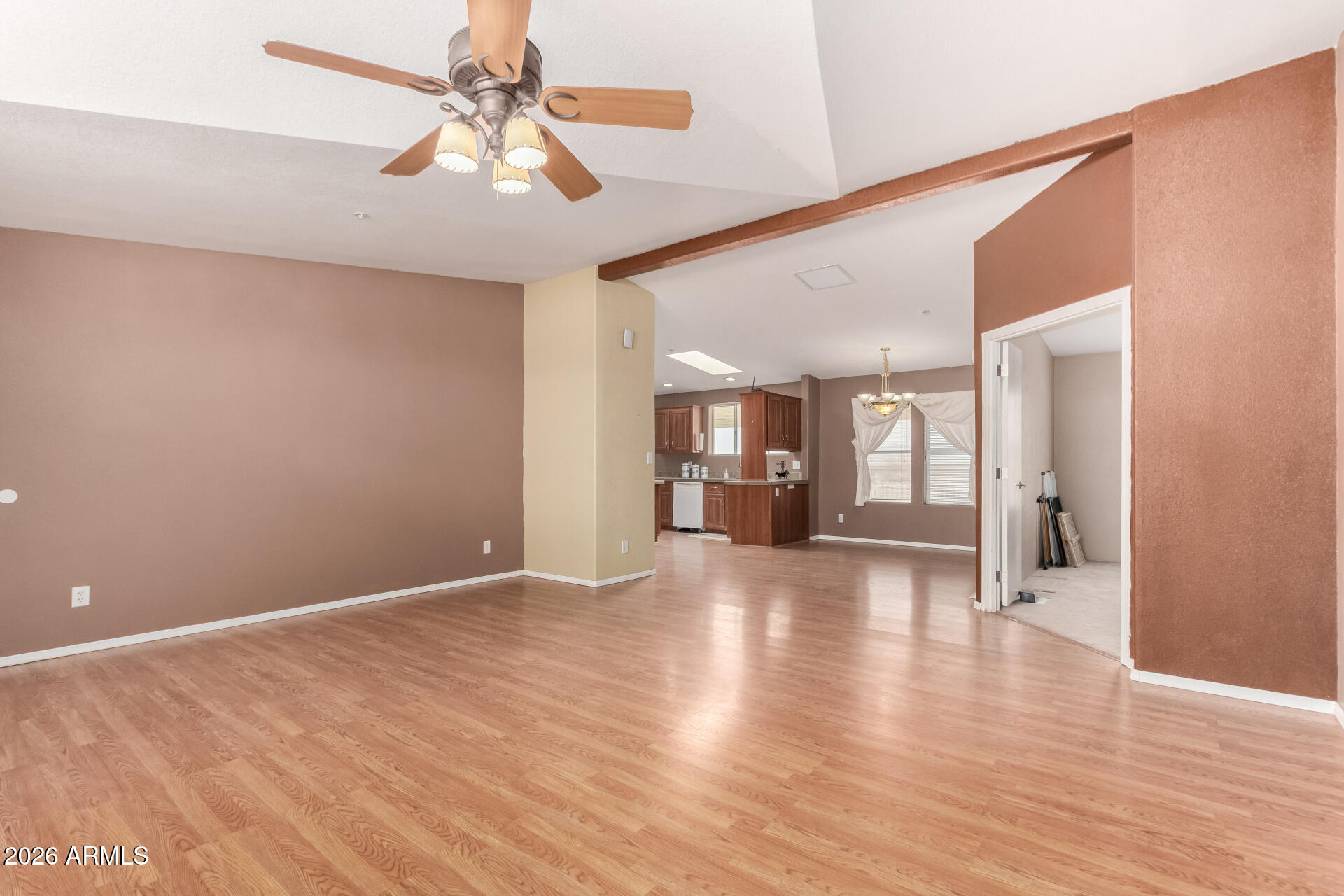 23851 West Tether Trail Wittmann, AZ 85361 - Photo 7 of 44 a view of a livingroom with wooden floor and a ceiling fan