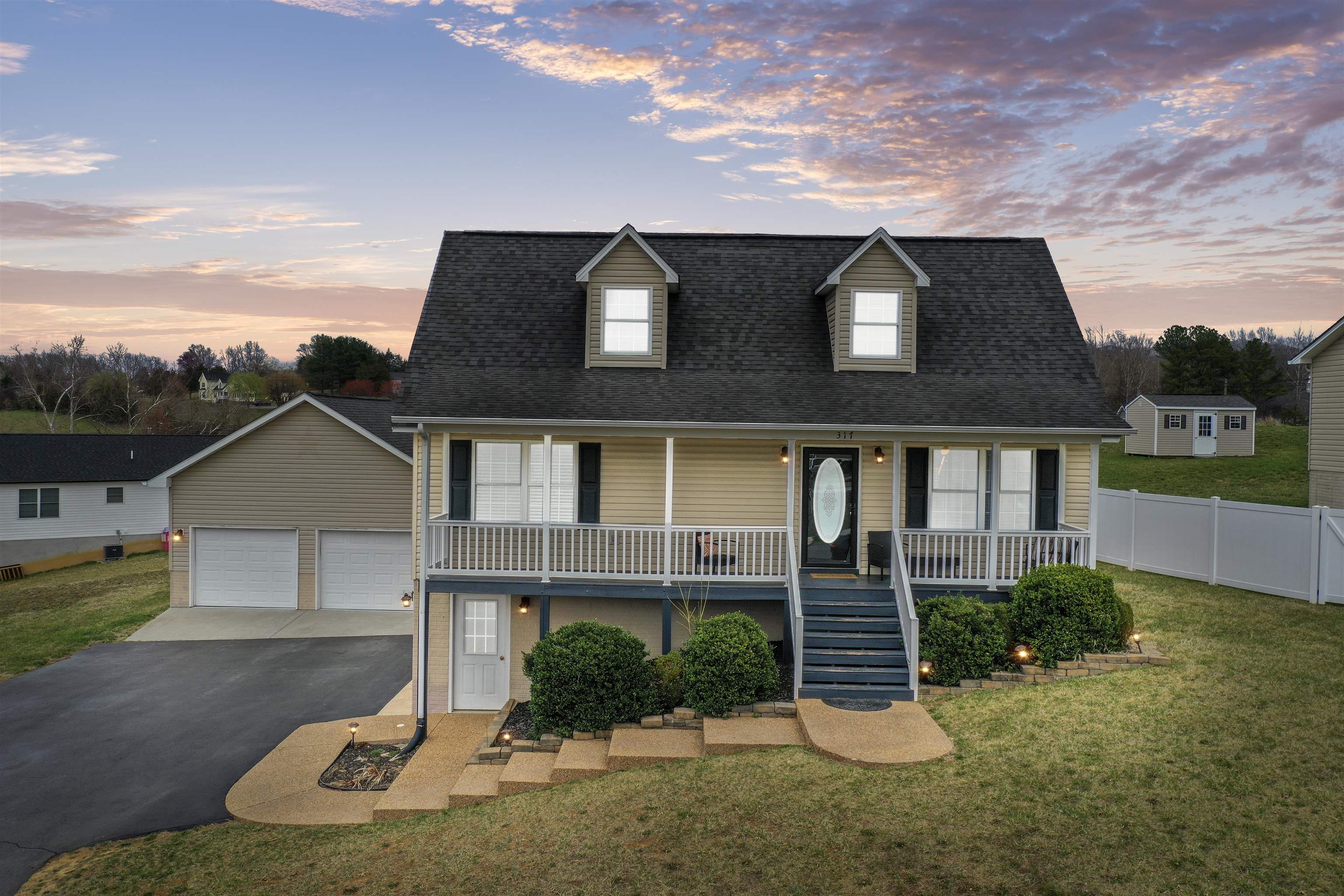 front view of a house with a yard