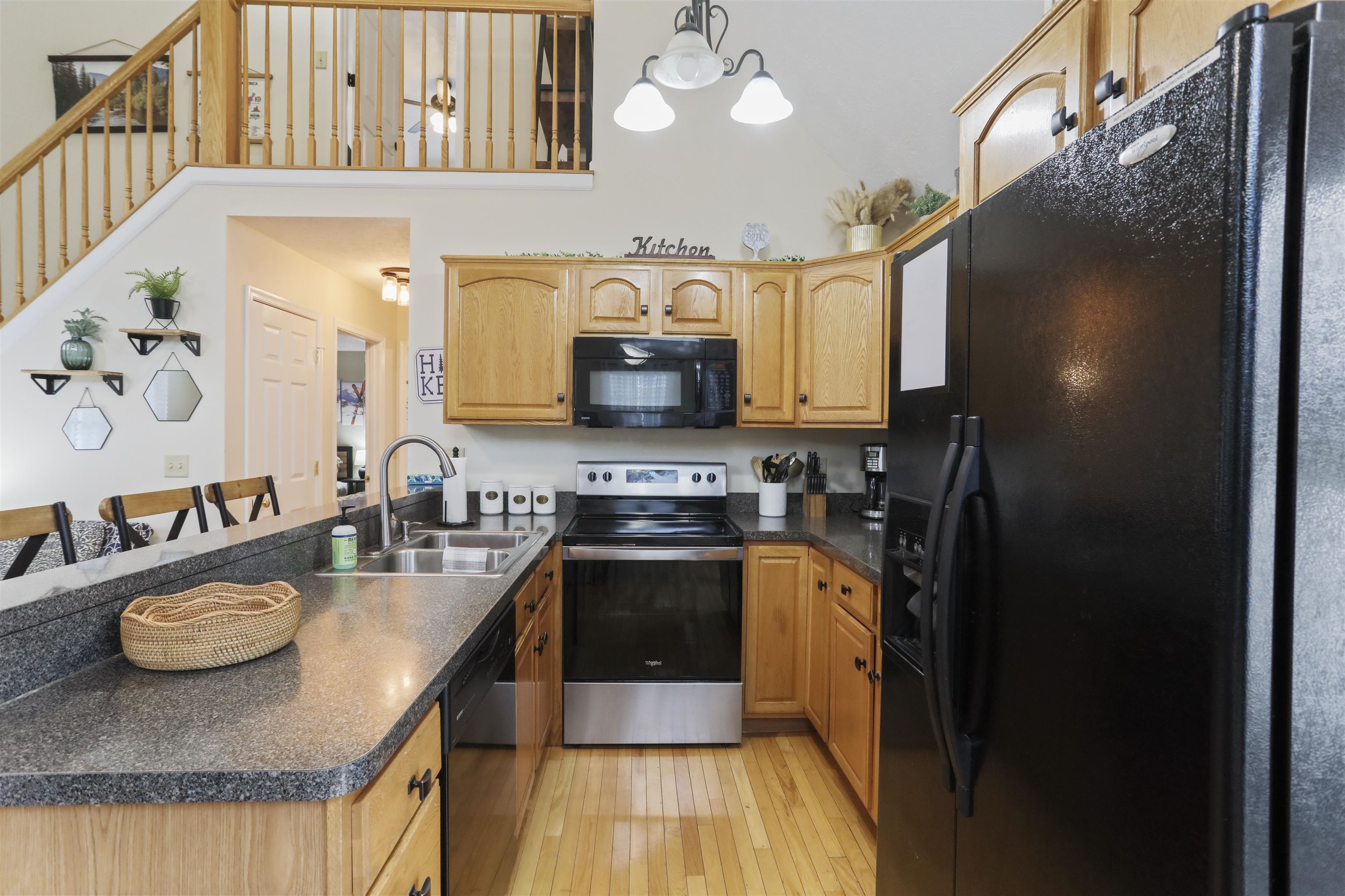 317 Locustdale Loop Shenandoah, VA 22849 - Photo 11 of 39 a kitchen with stainless steel appliances granite countertop a sink a stove and a wooden floors