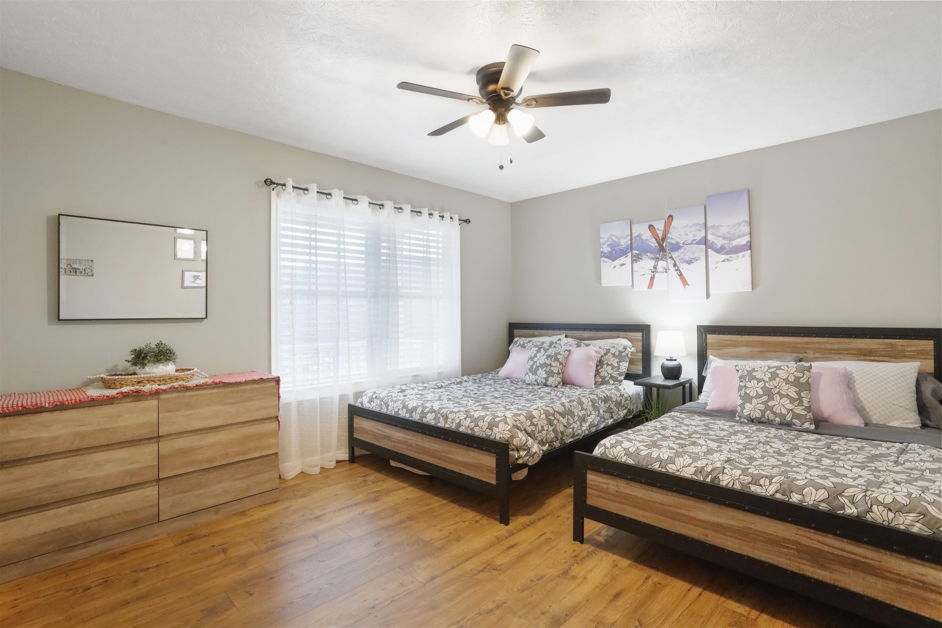 317 Locustdale Loop Shenandoah, VA 22849 - Photo 13 of 39 a bedroom with a bed and a chandelier