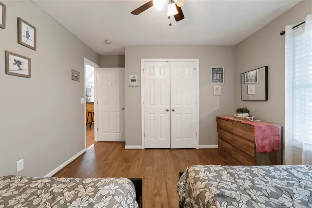 a bedroom with bed and window